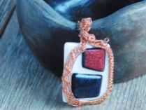 Another new piece: fused glass, white with red and black dichroic, wrapped in copper